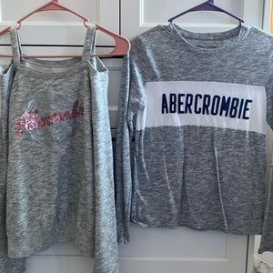 Left cold shoulder sweater is a 15/16 and the one to the right is a 11/12.